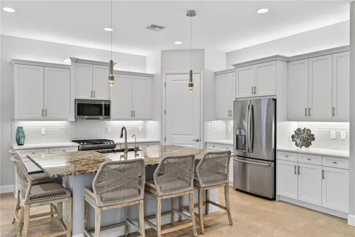 See the coffee bar space to left of fridge? LOTS of counter space for cooking daily or holiday dinners here!