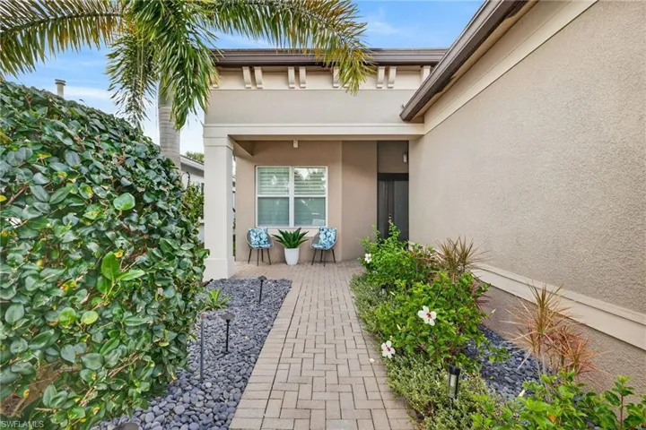 Private entry, welcoming front porch and plantation shutters on spare bedroom...