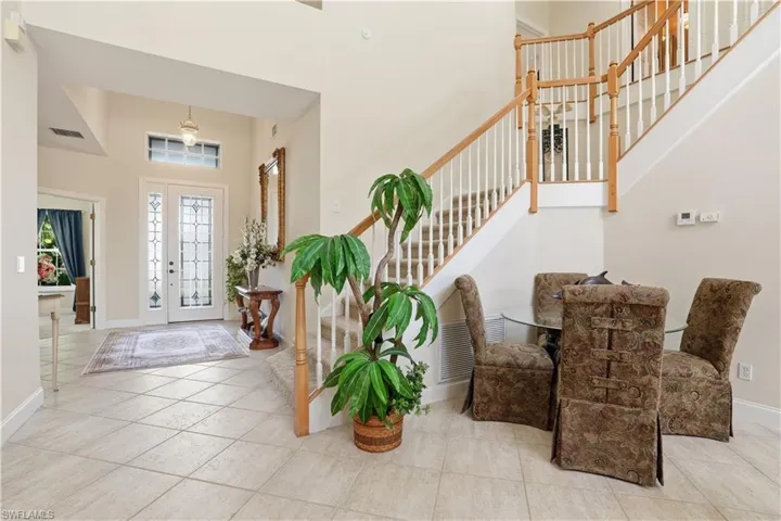 View of foyer and grand staircase.