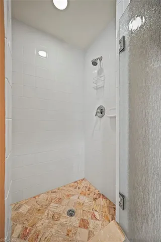 Bathroom with a tile shower