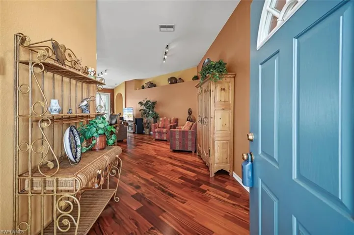 Foyer with dark hardwood / wood-style floors