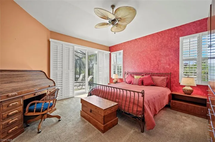 Bedroom featuring ceiling fan, access to outside, and carpet floors