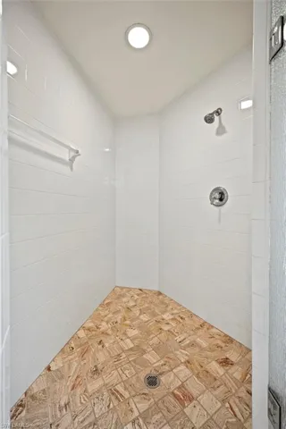 Bathroom featuring a tile shower