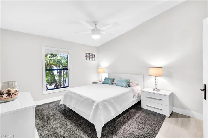 Bedroom with ceiling fan and Top down Bottom up window covering and it's own full bathroom