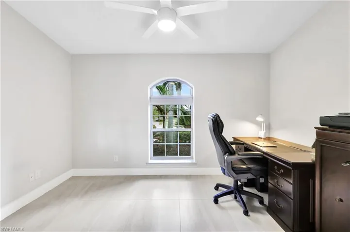 Office/Den with ceiling fan