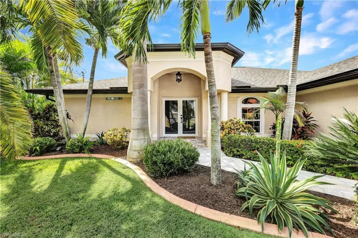View of front of property with a front lawn