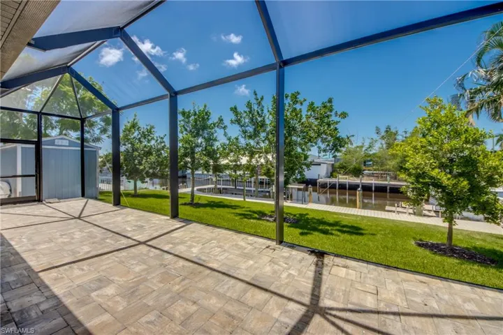 Unfurnished sunroom featuring a water view