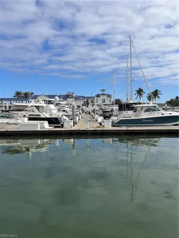 Dock area with a water view and view of marina