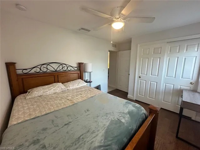 Bedroom with ceiling fan and a closet