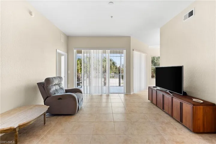 Living room with light tile floors
