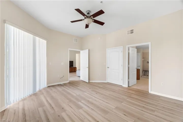 Spare room with ceiling fan and light hardwood / wood-style flooring