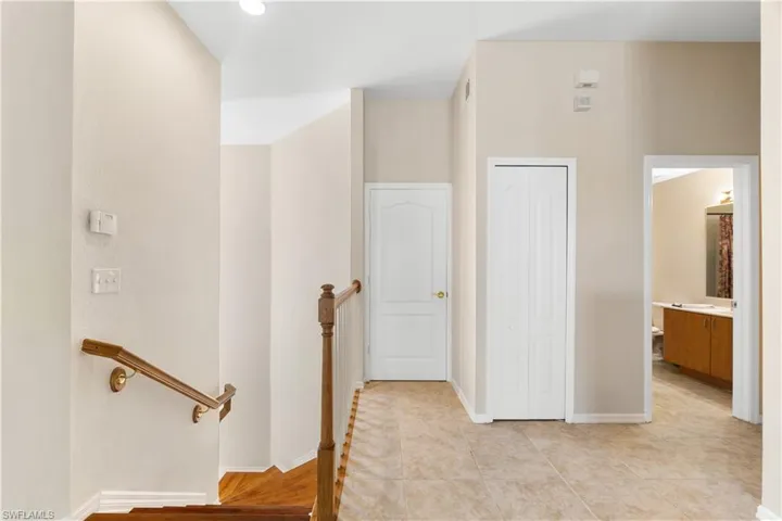 Hall with light tile floors