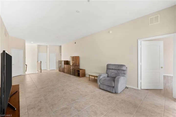 Living area with light tile flooring
