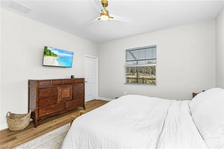 Bedroom featuring wood finished floors and a ceiling fan