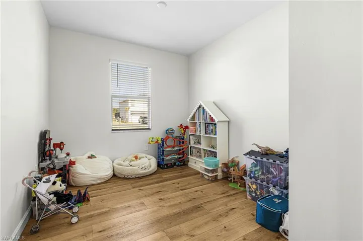 Playroom with light wood-style floors