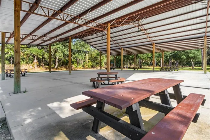 View of home's community with a patio area and outdoor dining space