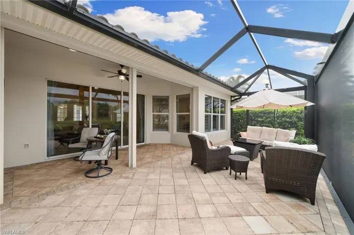 Outdoor panoramic lanai with covered area and ceiling fan