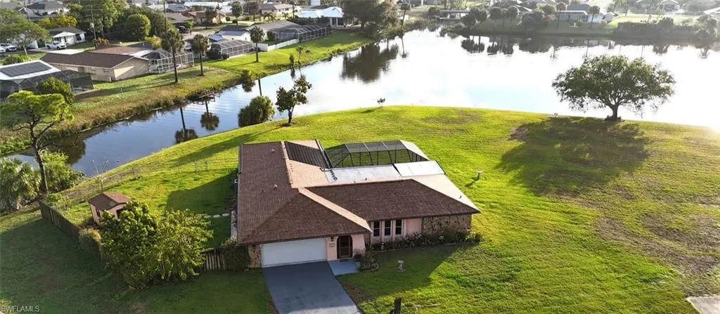 Aerial view of residential area featuring a large body of water