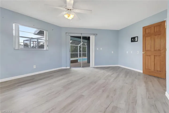 Unfurnished room with light wood-type flooring and a ceiling fan