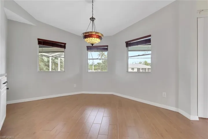 Unfurnished room with baseboards and light wood finished floors