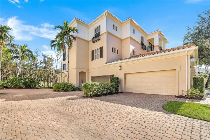 View of front of property with a balcony