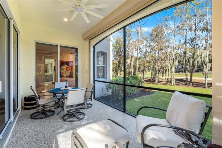 Sunroom featuring ceiling fan