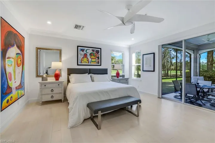 Bedroom with access to exterior, light wood-type flooring, ceiling fan, and crown molding