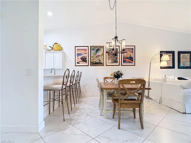 DINING AREA AND BREAKFAST BAR WITH STOOLS
