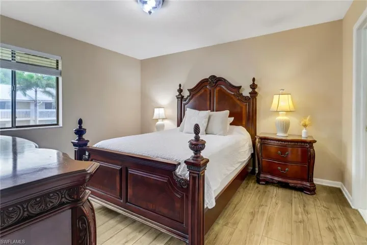 Bedroom with light wood-type flooring and baseboards