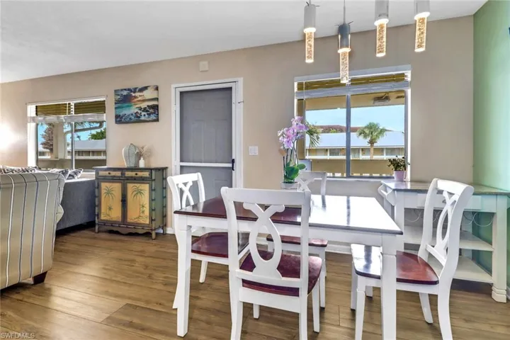 Dining room featuring wood finished floors and plenty of natural light