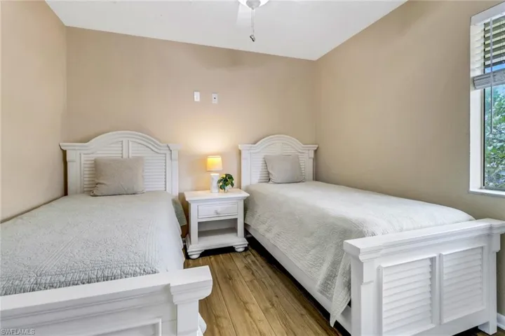 Bedroom featuring wood finished floors and ceiling fan