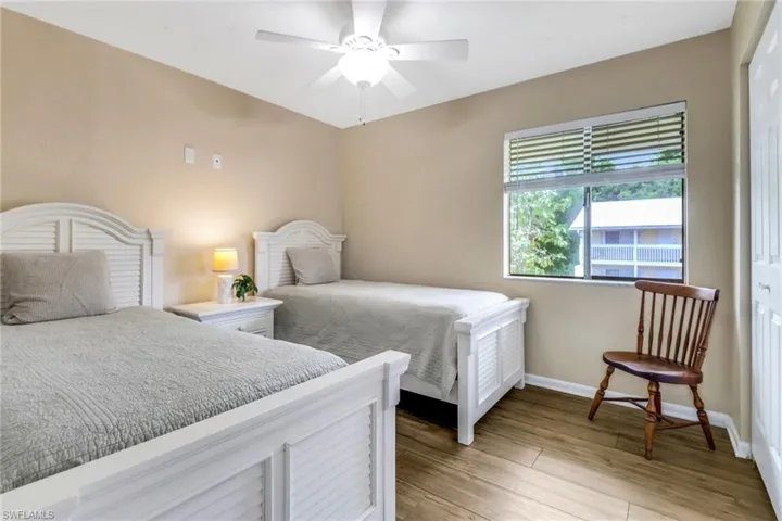 Bedroom featuring a closet, light wood-type flooring, and a ceiling fan