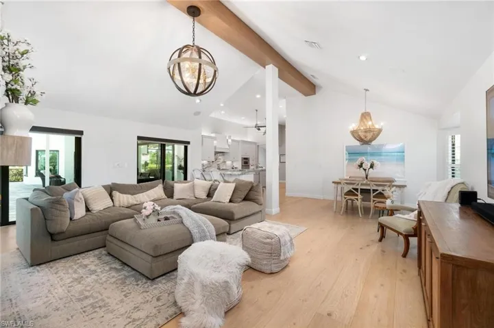 Living room featuring a chandelier and light wood-style flooring