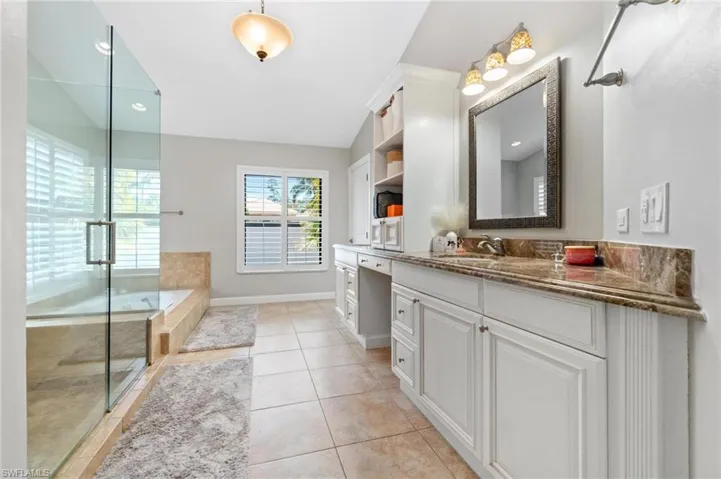 Full bathroom with vanity, a bath, recessed lighting, a stall shower, and light tile patterned flooring