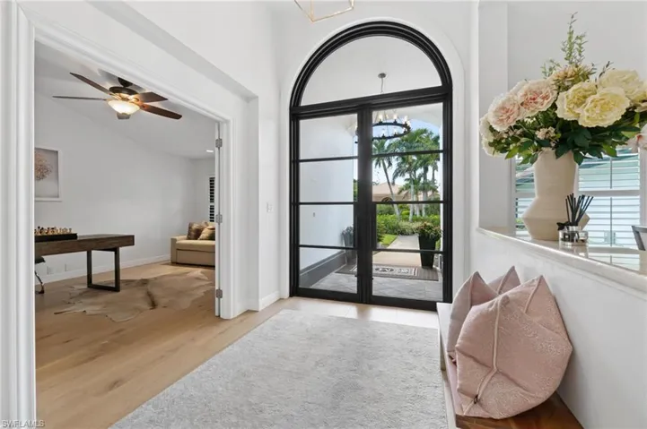 Entryway featuring light wood-style floors and a ceiling fan