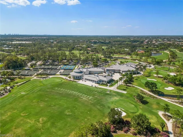 Aerial overview of property's location with a golf club, a nearby body of water, and nearby suburban area