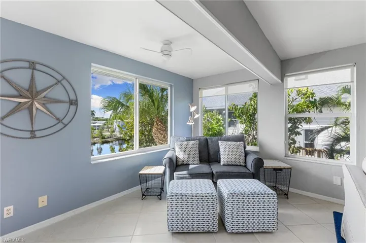 Sunroom with a water view