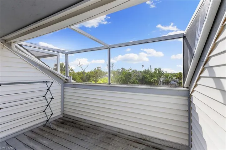 Deck featuring a sunroom