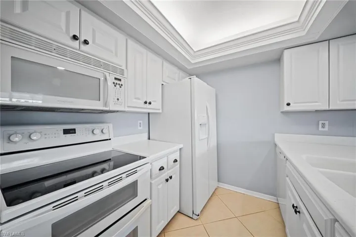 White cabinetry with dark hardware