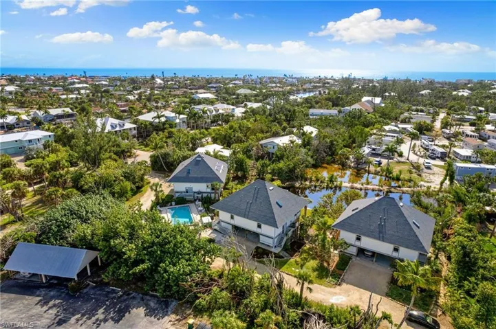 Aerial view of residential area featuring a large body of water