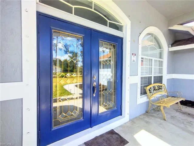 Property entrance with french doors
