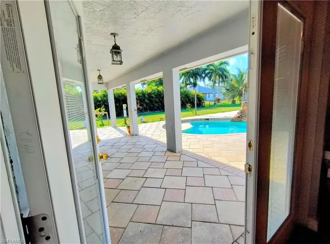 French Doors from Living Room to Lanai and Pool
