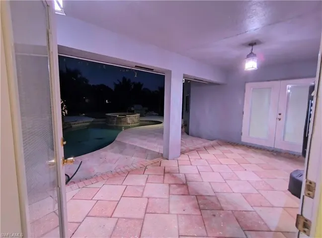 View of patio / terrace featuring an in ground hot tub