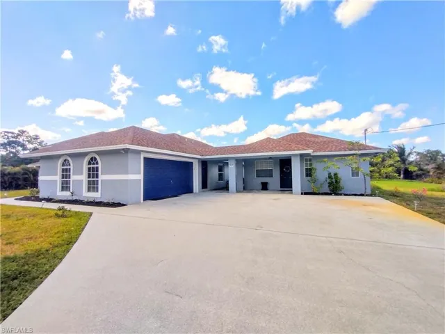 View of front of Guest House and garage