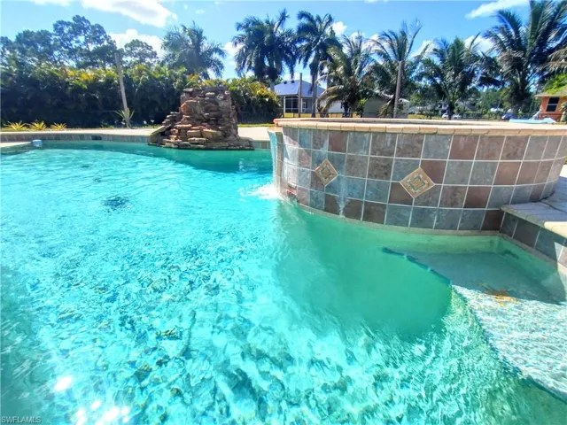 View of pool with pool water feature