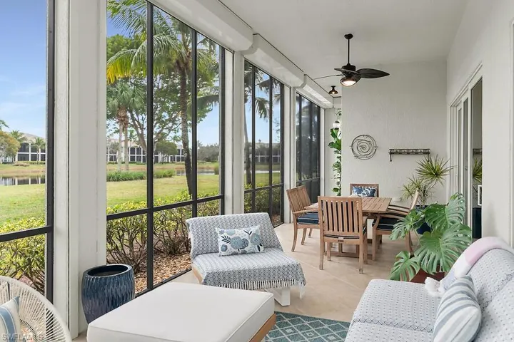 Lanai featuring water view all around, outdoor dining area, ceiling fan, outdoor living space