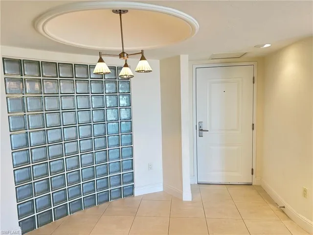 Tiled entryway with baseboards