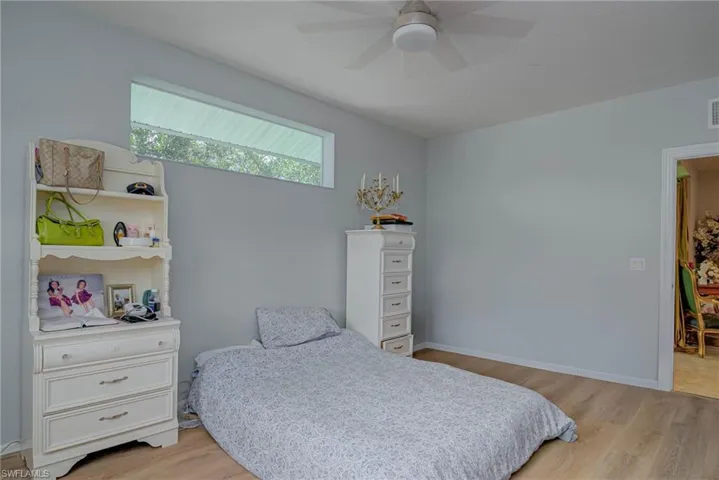 Bedroom with light wood-style flooring and ceiling fan