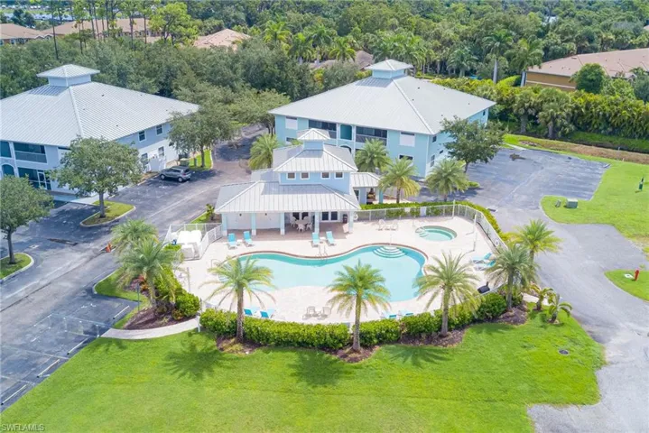 Aerial view of property and surrounding area with a pool
