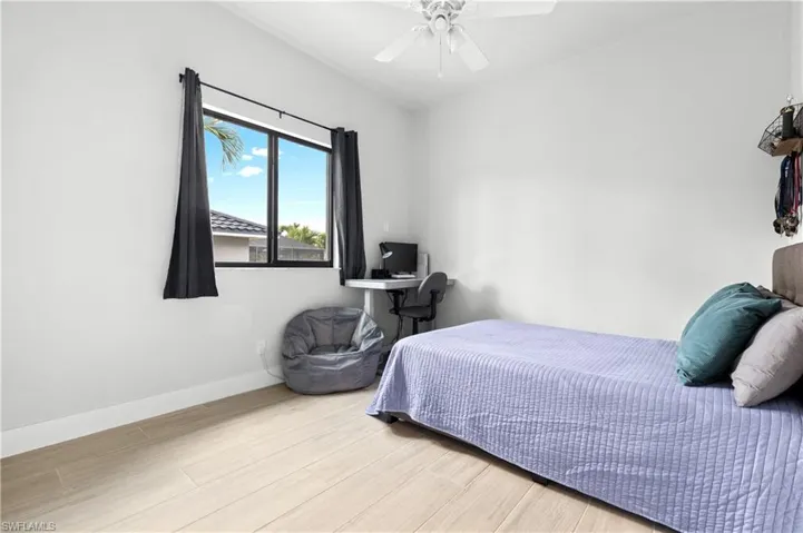 Bedroom featuring light wood-style floors and ceiling fan